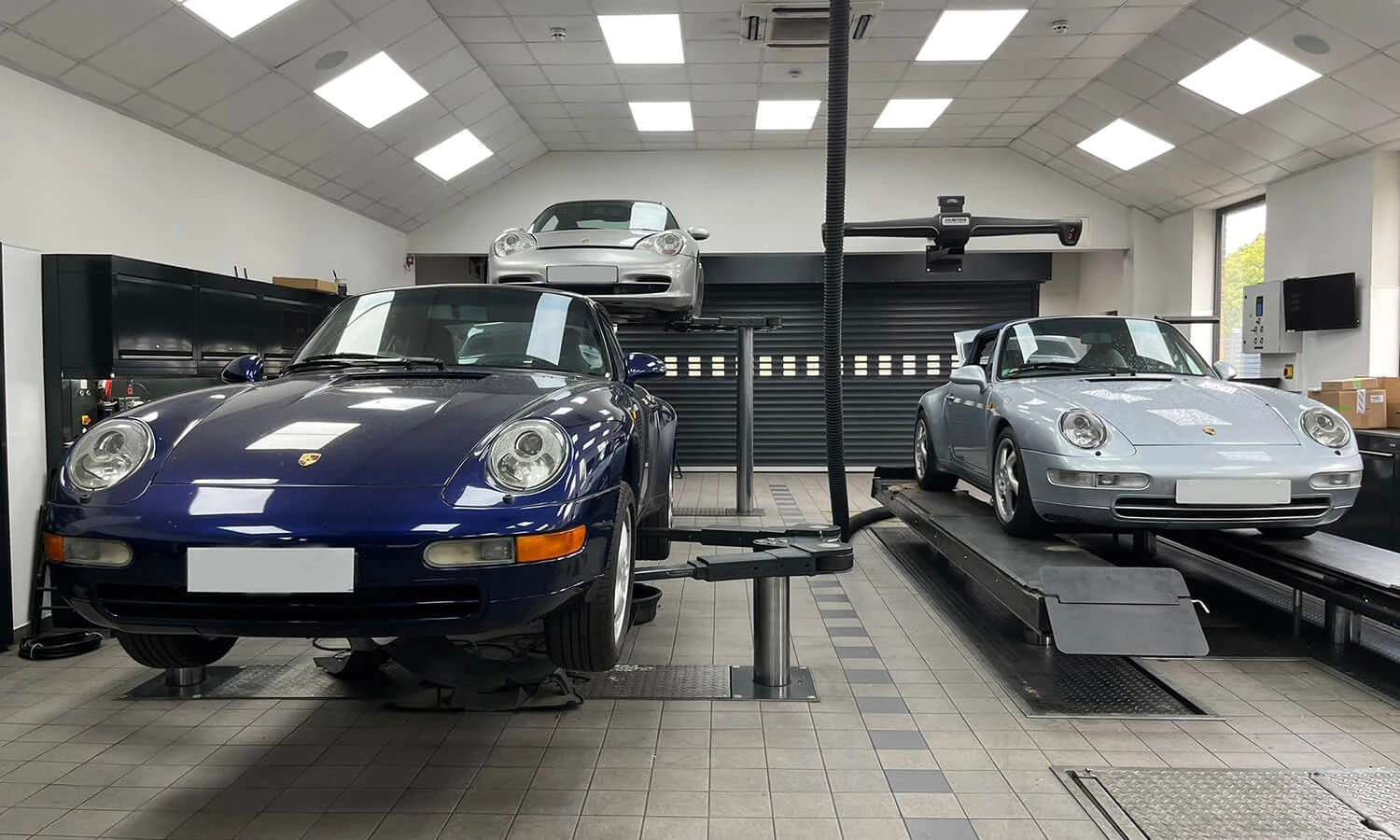 Porsche cars inside a service workshop
